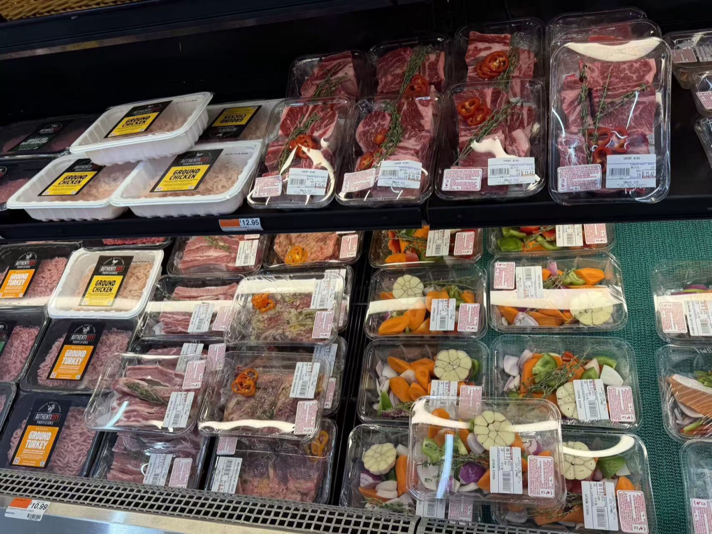 Fresh meat, ground chicken, and ready-to-cook grocery packs in the SMART LIC cold case